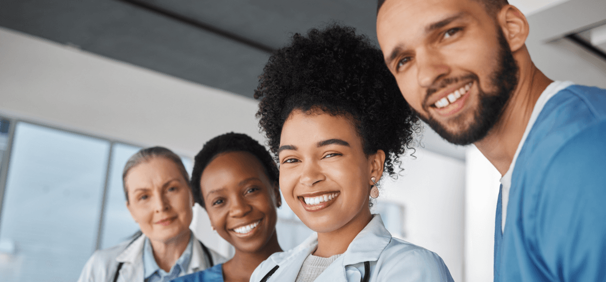 Diverse team of smiling healthcare professionals in a medical setting, representing Optum OR